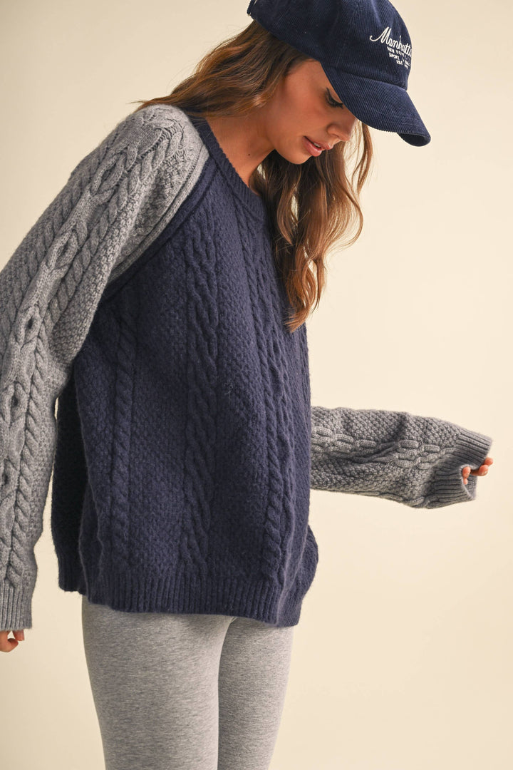 COLOR BLOCK CABLE KNIT SWEATER