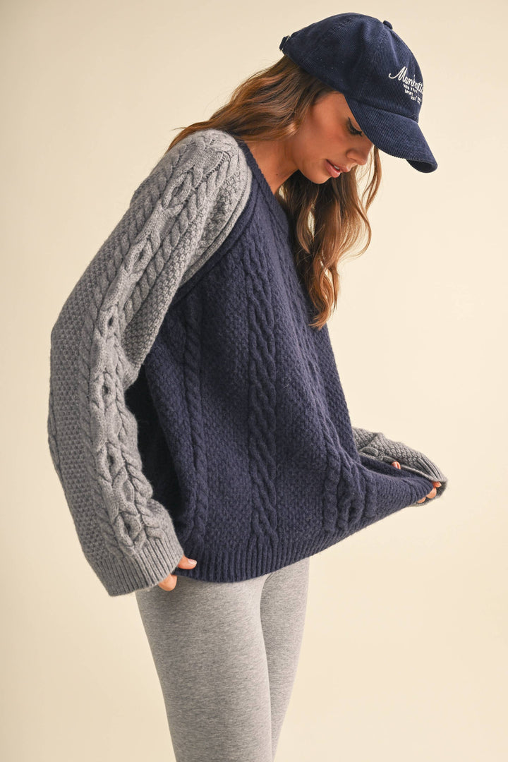 COLOR BLOCK CABLE KNIT SWEATER