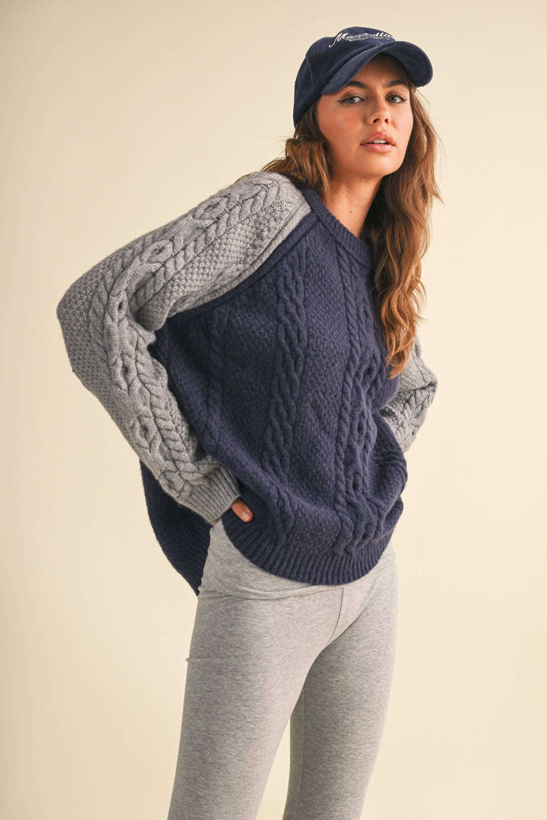 COLOR BLOCK CABLE KNIT SWEATER