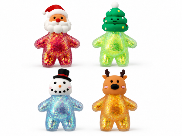 Four small glittery bear-shaped holiday figurines on a white background: Santa in red and pink glitter, a Christmas tree in green glitter, a snowman in light blue glitter, and a reindeer in gold glitter.
