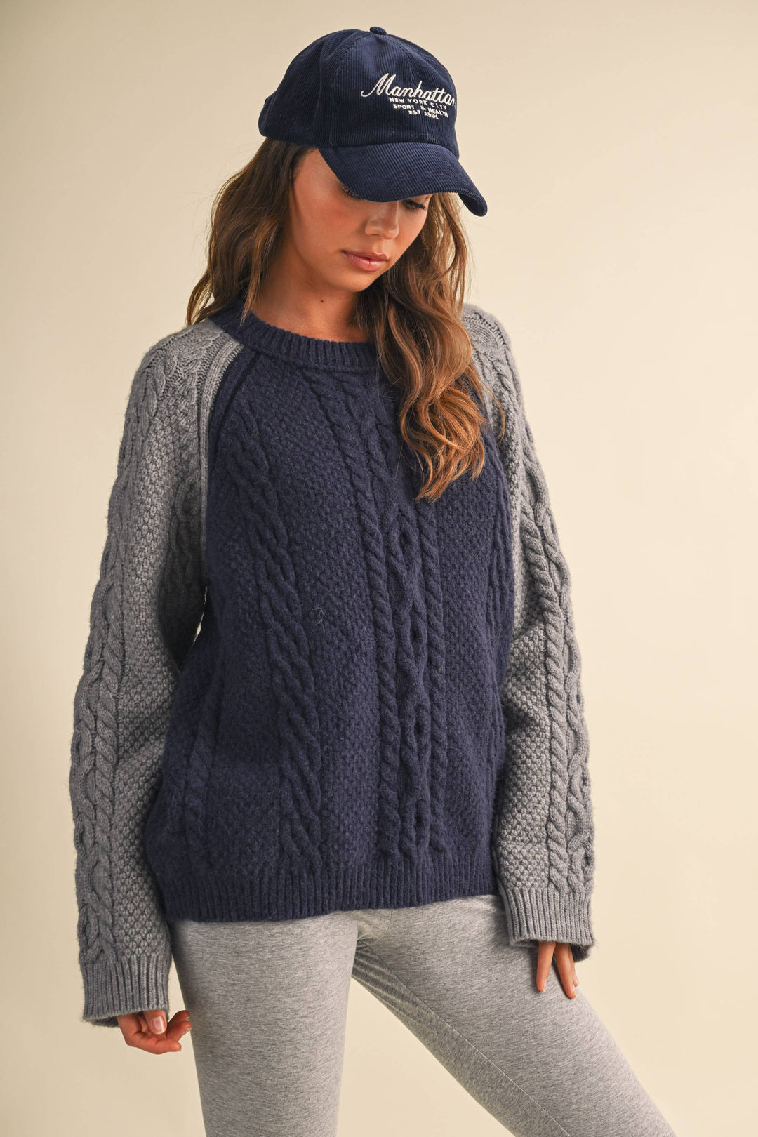 COLOR BLOCK CABLE KNIT SWEATER