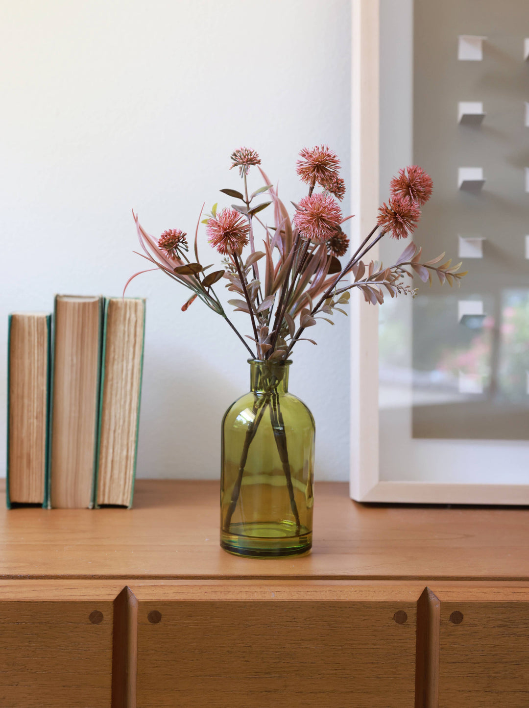 Faux Floral Arrangement in Green Glass Bottle