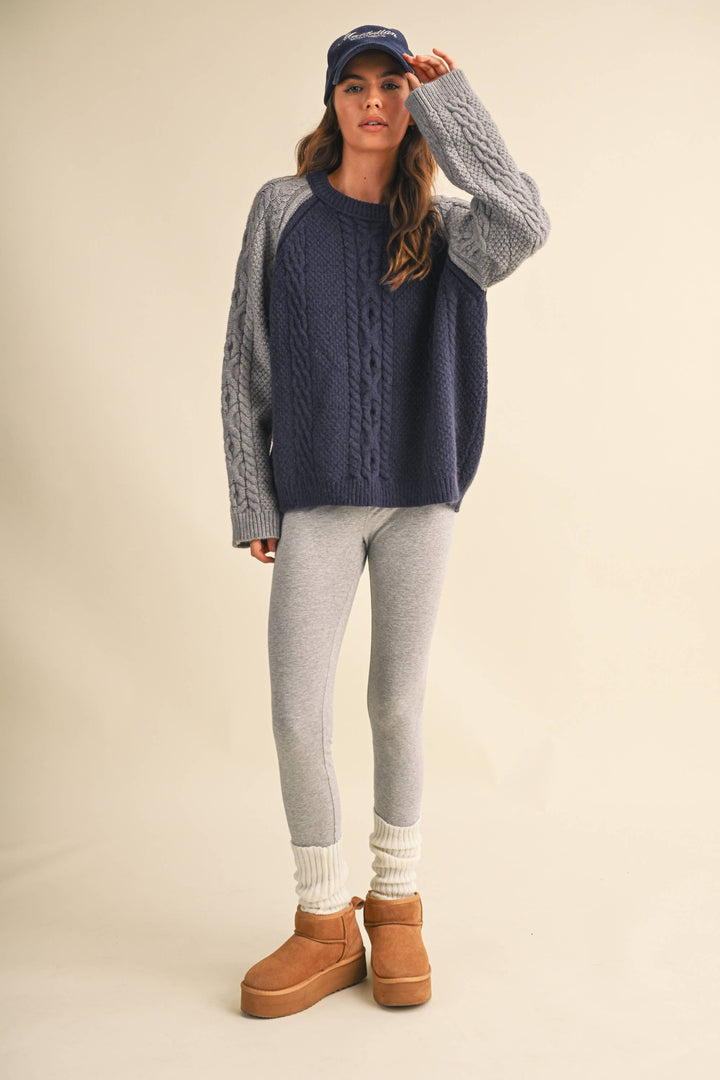 COLOR BLOCK CABLE KNIT SWEATER