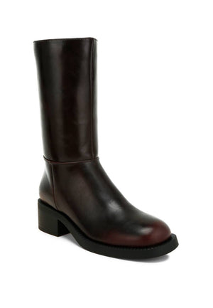 Brown leather boot on a white background