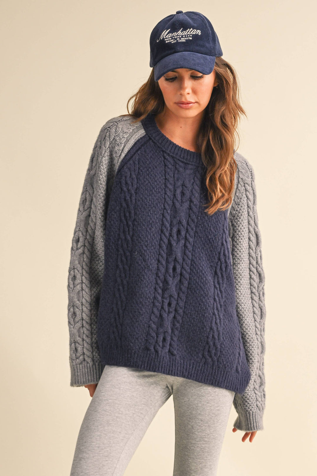 COLOR BLOCK CABLE KNIT SWEATER