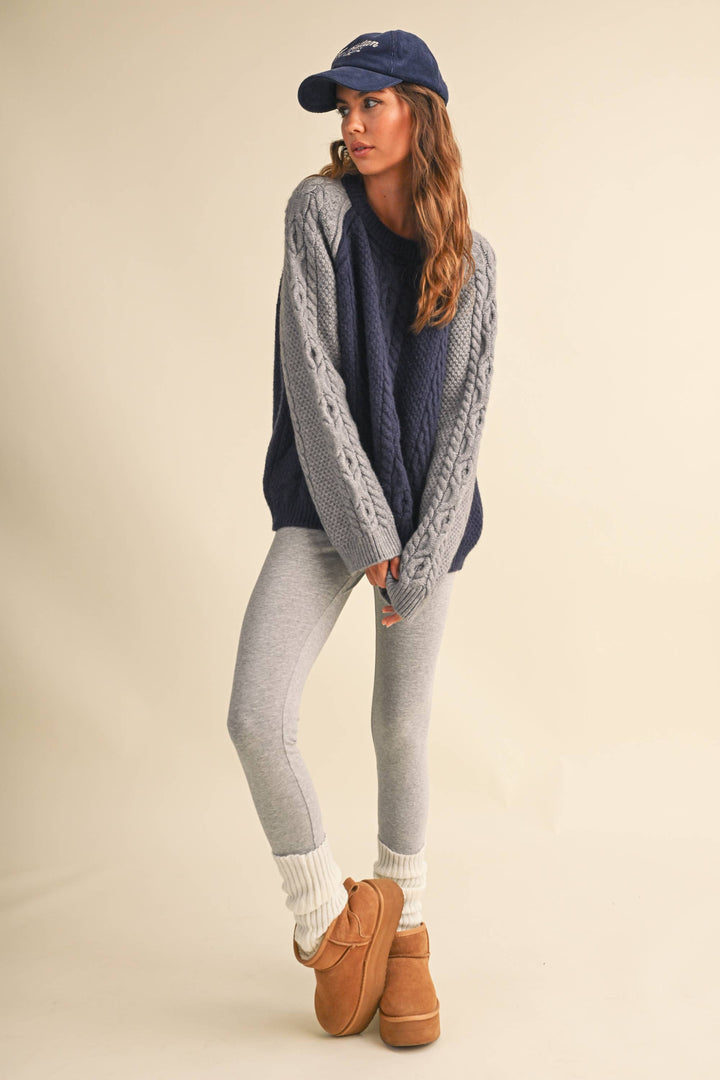 COLOR BLOCK CABLE KNIT SWEATER