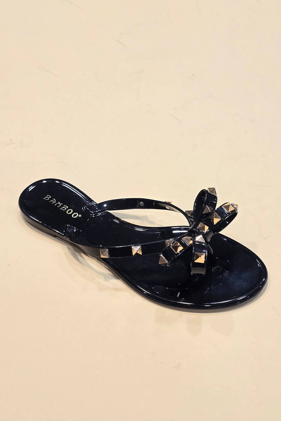 STUD BOW BLACK JELLY THONGS