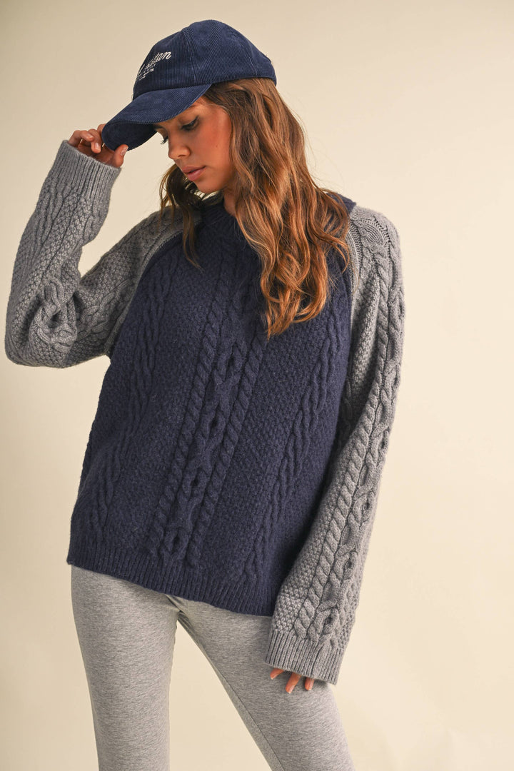 COLOR BLOCK CABLE KNIT SWEATER