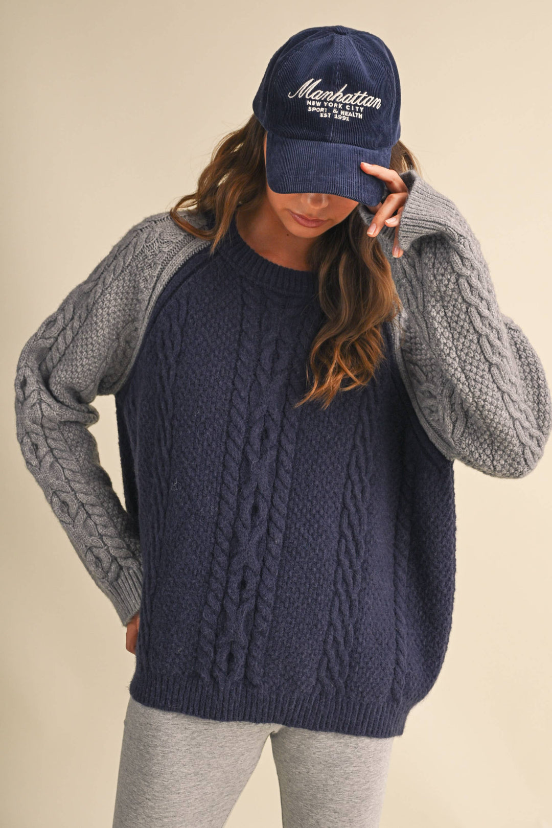 COLOR BLOCK CABLE KNIT SWEATER