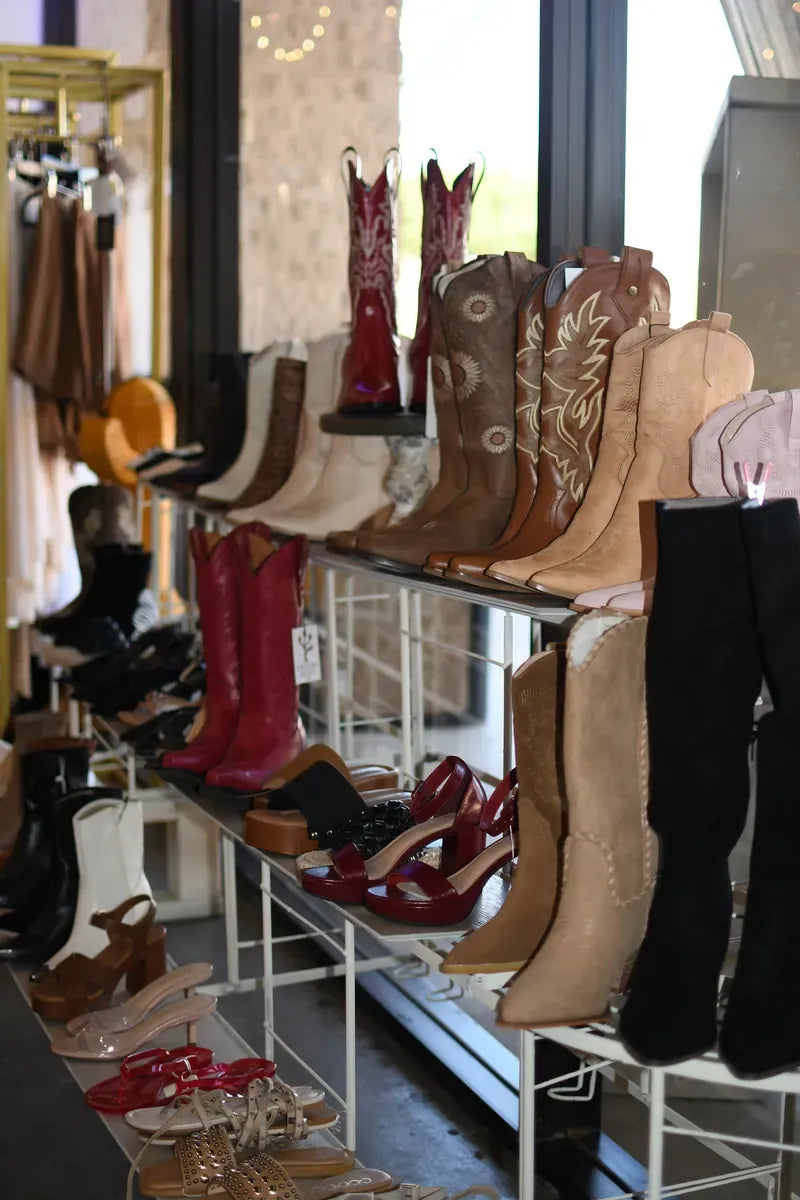 Wall of western boots and heels in the boutique