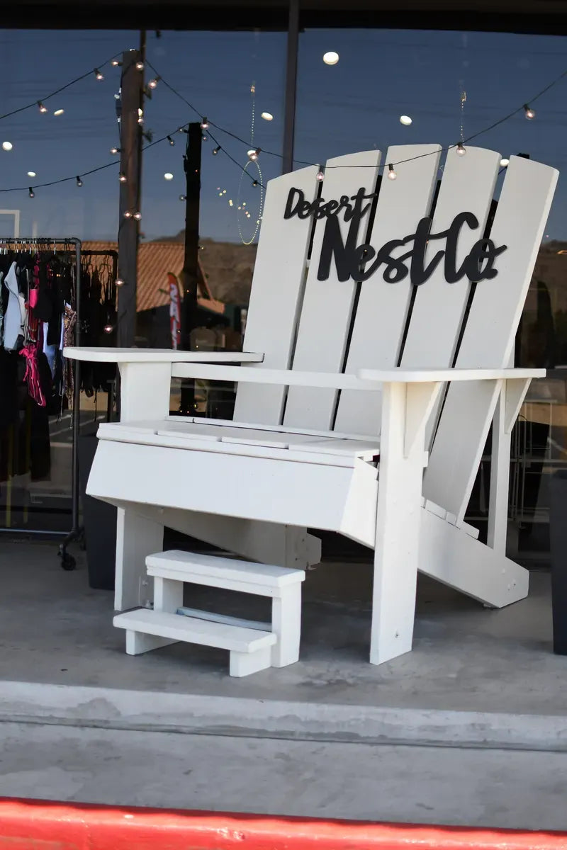 Oversized white Desert Nest Co. chair outside the shop